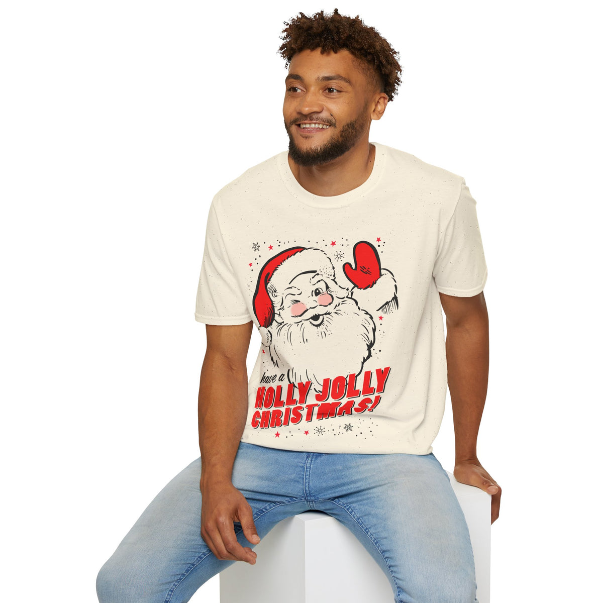 Man wearing a cream t-shirt with a Santa Claus graphic and 'Have a Holly Jolly Christmas!' text.