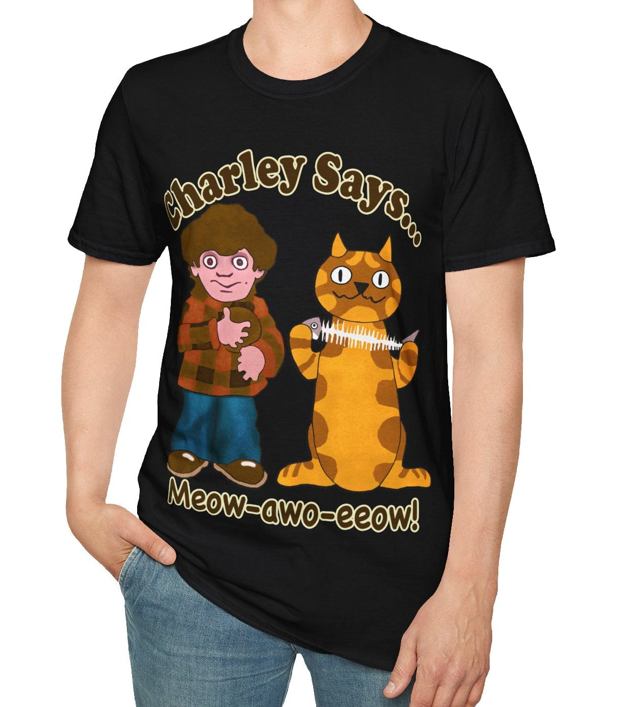 Person wearing a black t-shirt with a graphic of a boy and a cat, and text Charley Says Meow