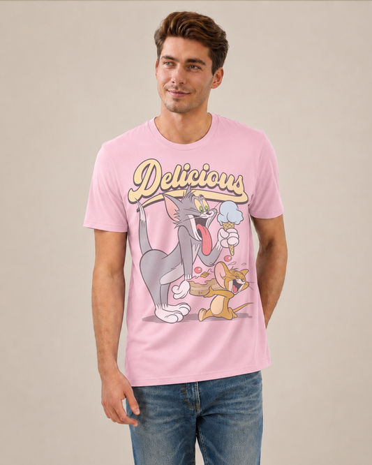 Man wearing an Official Tom and Jerry Pink t-shirt with cartoon Tom eating ice cream and Jerry eating cake and 'Delicious' text above