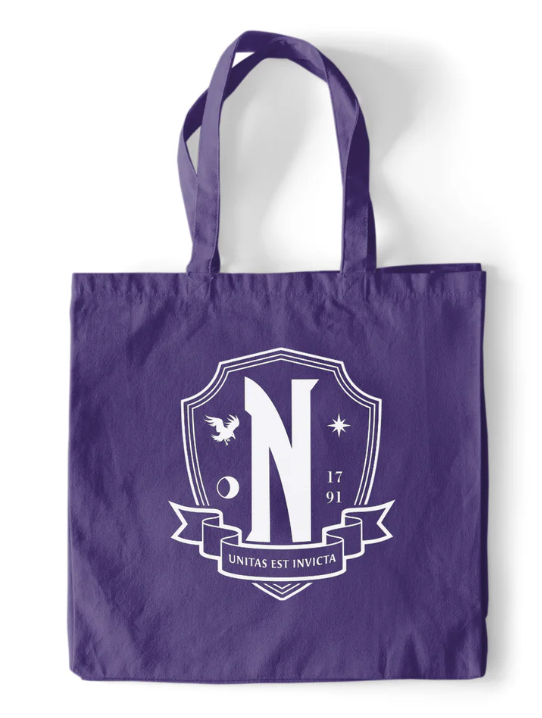 Purple tote bag with a white emblem featuring a letter 'N' on a white background