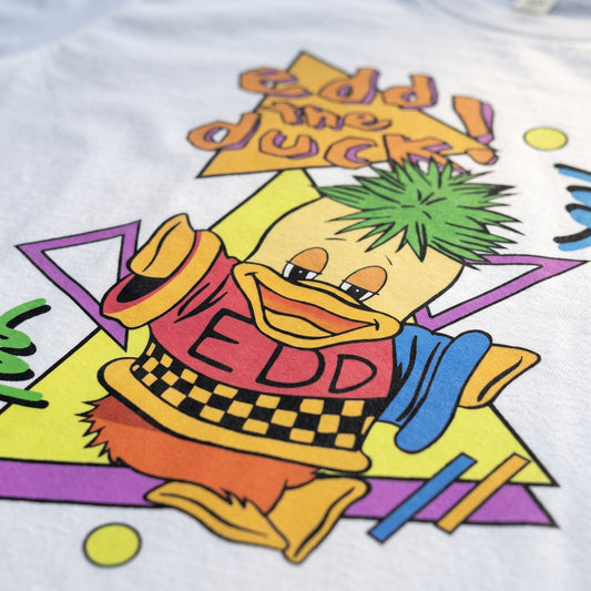 Close-up of colourful Edd the Duck retro 90s TV graphic on white T-shirt