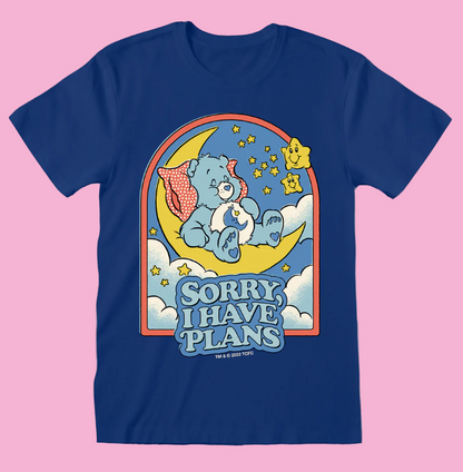 Steven Rhodes Care Bears Blue t-shirt with Bedtime bear on a moon, surrounded by stars and clouds, with 'Sorry I Have Plans' text.