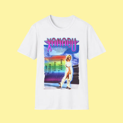 White t-shirt with a colorful graphic design featuring a person and the word 'Xanadu' on a white background.