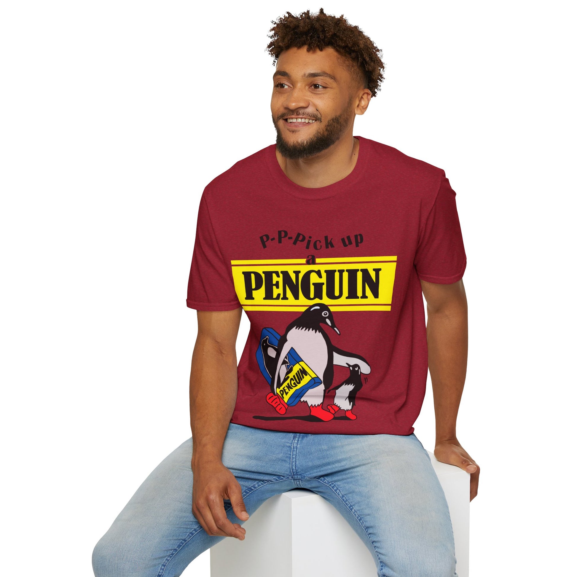 Person wearing a red t-shirt with a penguin graphic and text P-P-Pick up a Penguin on a white background