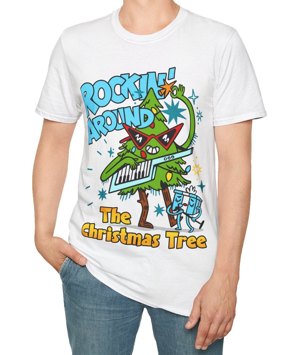 Person wearing a Retro Music Inspired White t-shirt with a colourful graphic of a Christmas tree and text Rockin Around The Christmas Tree 