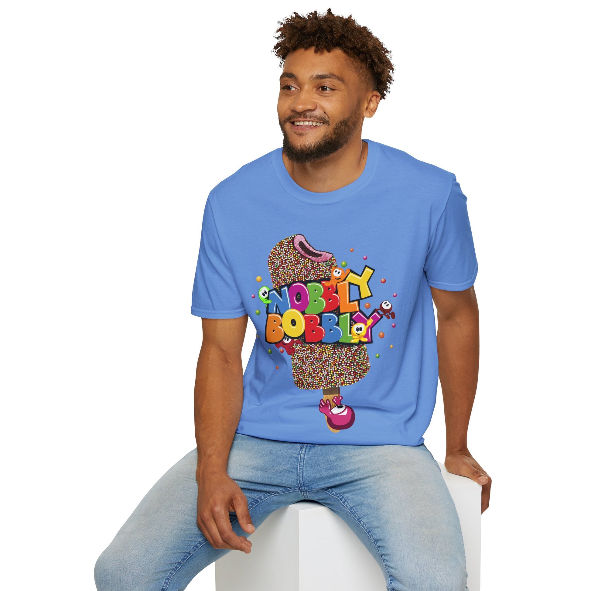 Man wearing a blue t-shirt with colorful graphic design on a white background