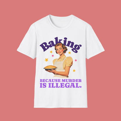 White t-shirt with a graphic of a woman holding a pie and text 'Baking Because Murder is Illegal' on a white background.