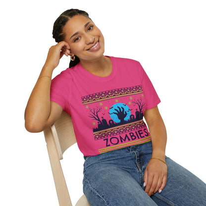 Person wearing a pink t-shirt with a green and blue graphic design featuring a zombie theme and text 'Zombies Never Die' on a white background.