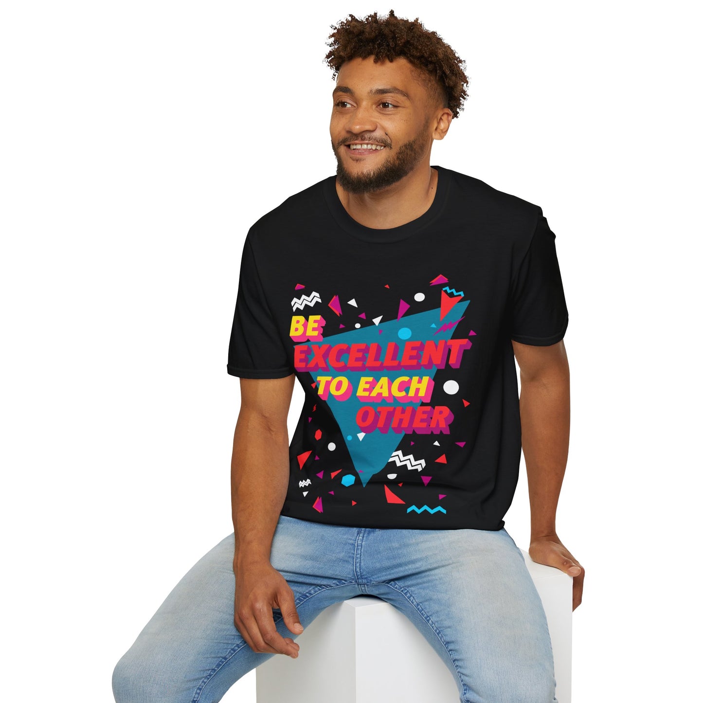 Man wearing a black t-shirt with colourful geometric design and Be Excellent to each other text 