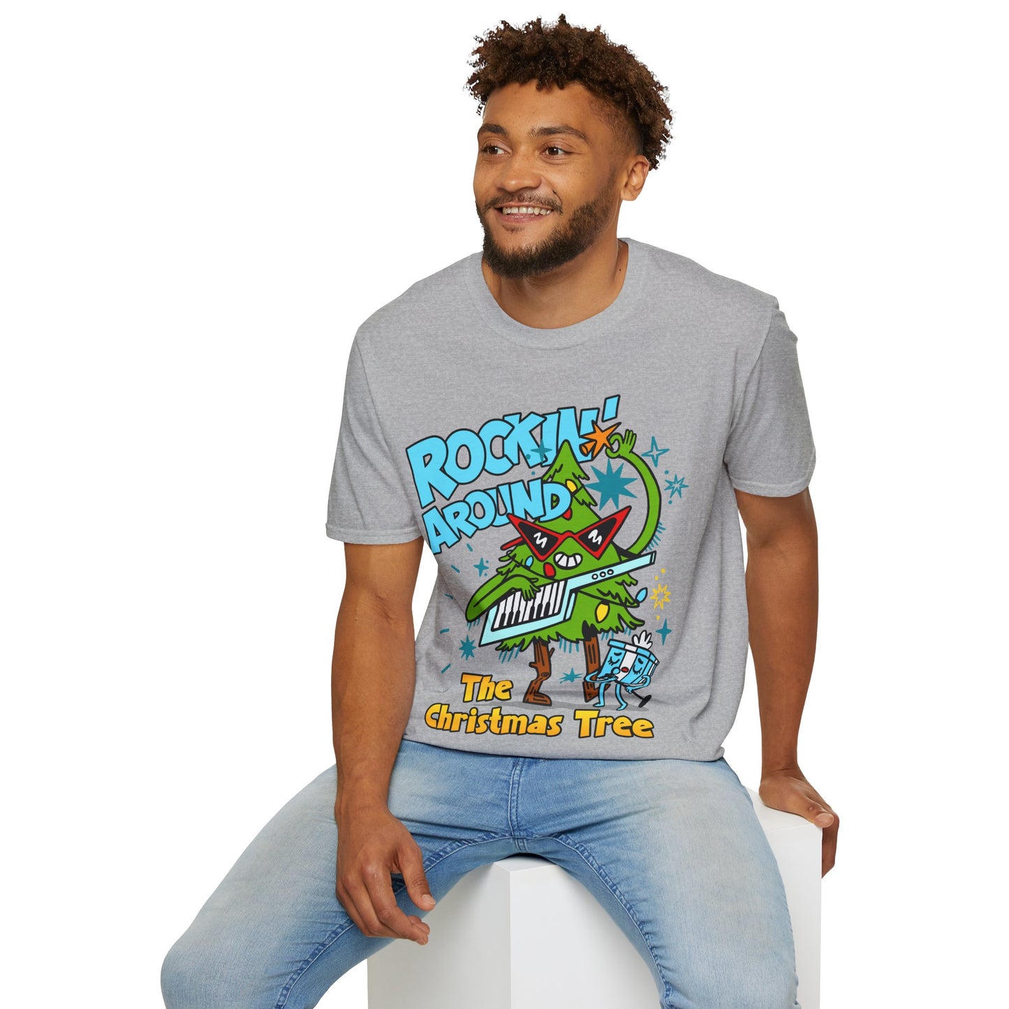 Person wearing a Retro christmas Music Inspired grey t-shirt with a colourful graphic of a Christmas tree and text Rockin Around The Christmas Tree 