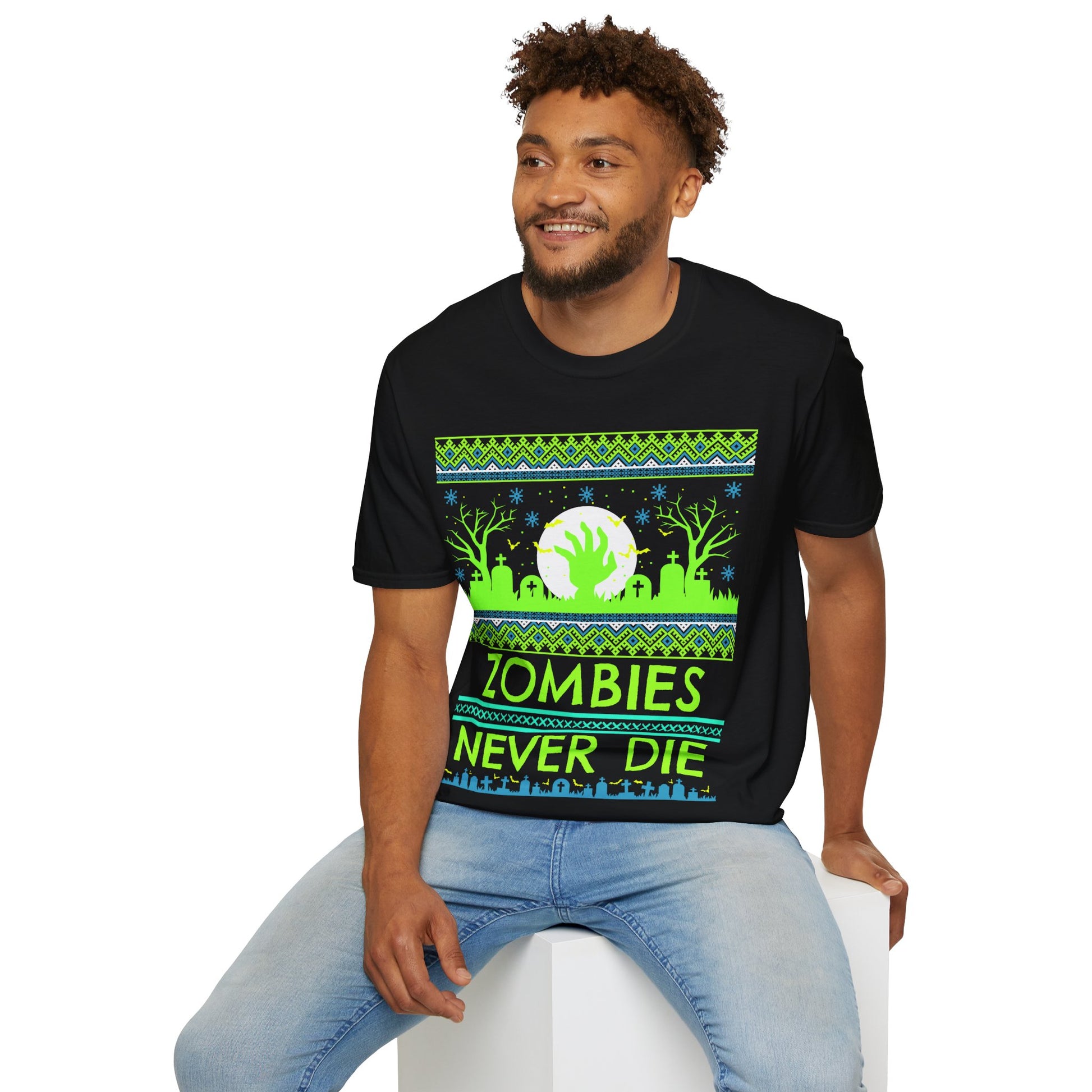 Man wearing a black t-shirt with a green and blue vibrant graphic design featuring a zombie theme and text 'Zombies Never Die' on a white background.