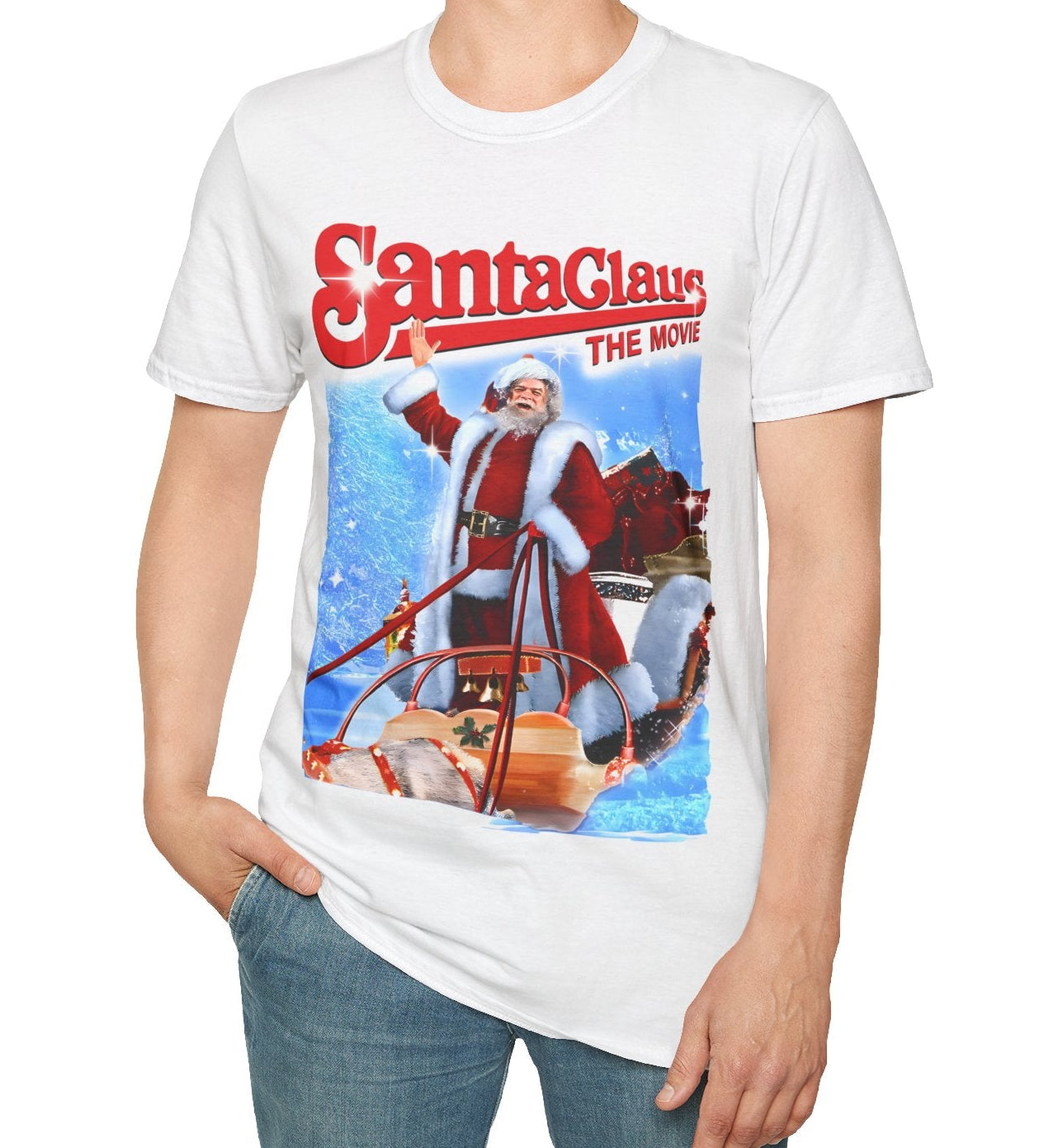 Person wearing a white t-shirt with 'Santa Claus: The Movie' graphic design on a white background