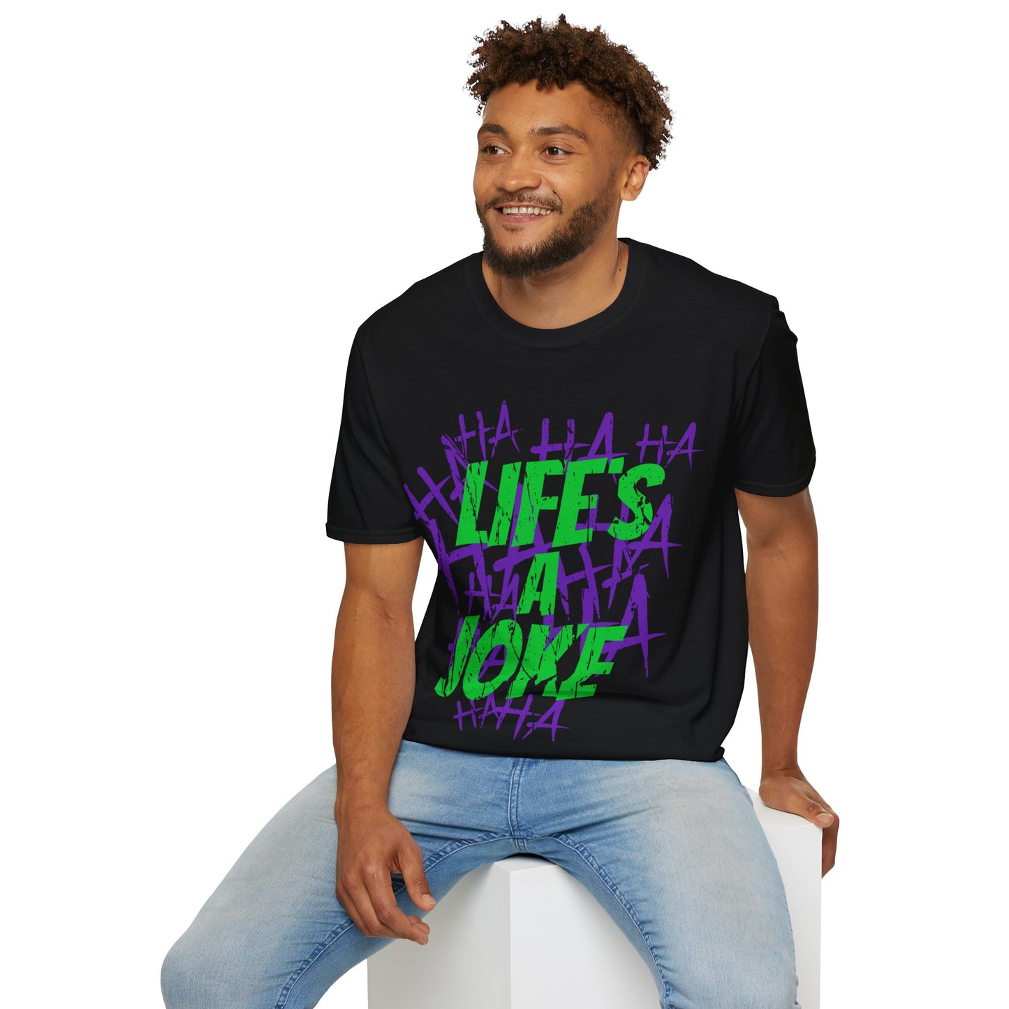 Man wearing a black t-shirt with colourful text design Green, Life's A Joke with purple HA HA HA HA on a white background