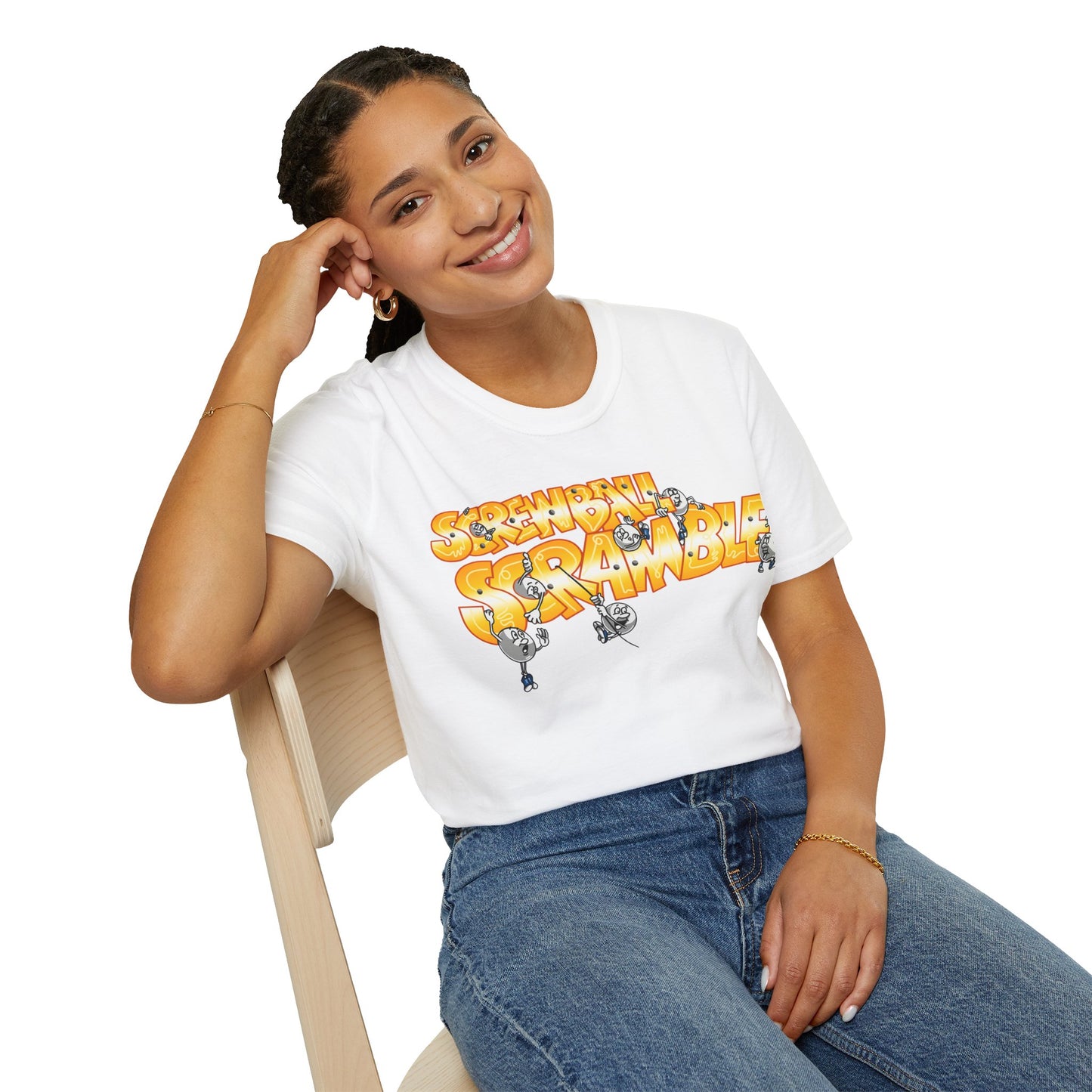 Person wearing a white t-shirt with 'Screwball Scramble' graphic design  and text, sitting on a chair.