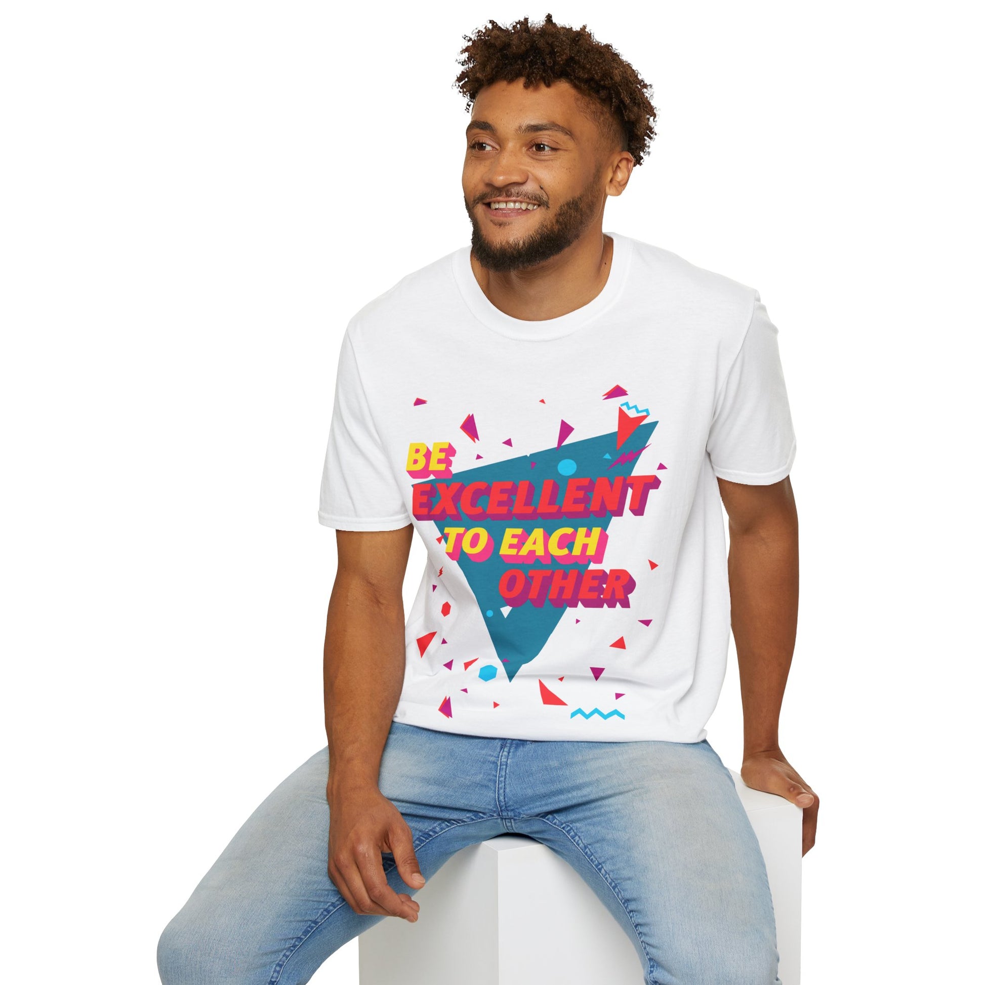 Man wearing a white t-shirt with colourful geometric design and Be Excellent to each other text 