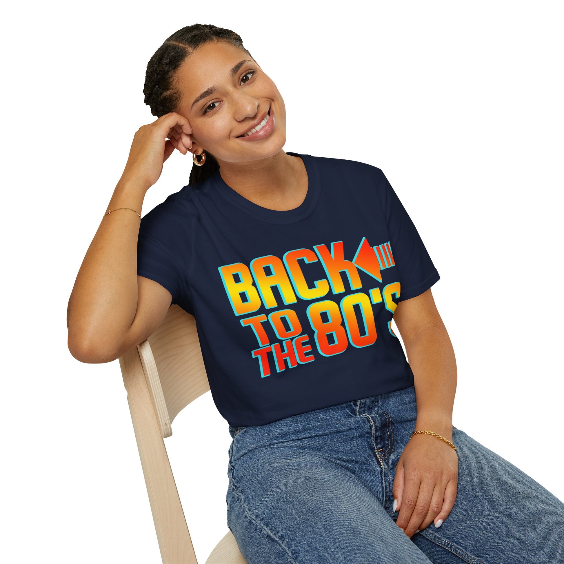 Woman wearing a navy blue t-shirt with 'Back to the 80s' text, sitting on a chair.