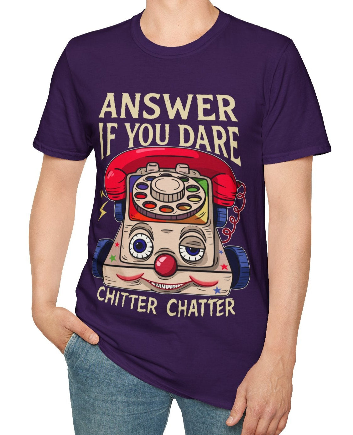 Man wearing a purple t-shirt with a eerie vintage toy phone graphic and Answer if you dare text, on a white background
