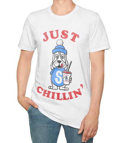 Person wearing a white t-shirt with a puppie graphic design and Just Chillin text on a white background