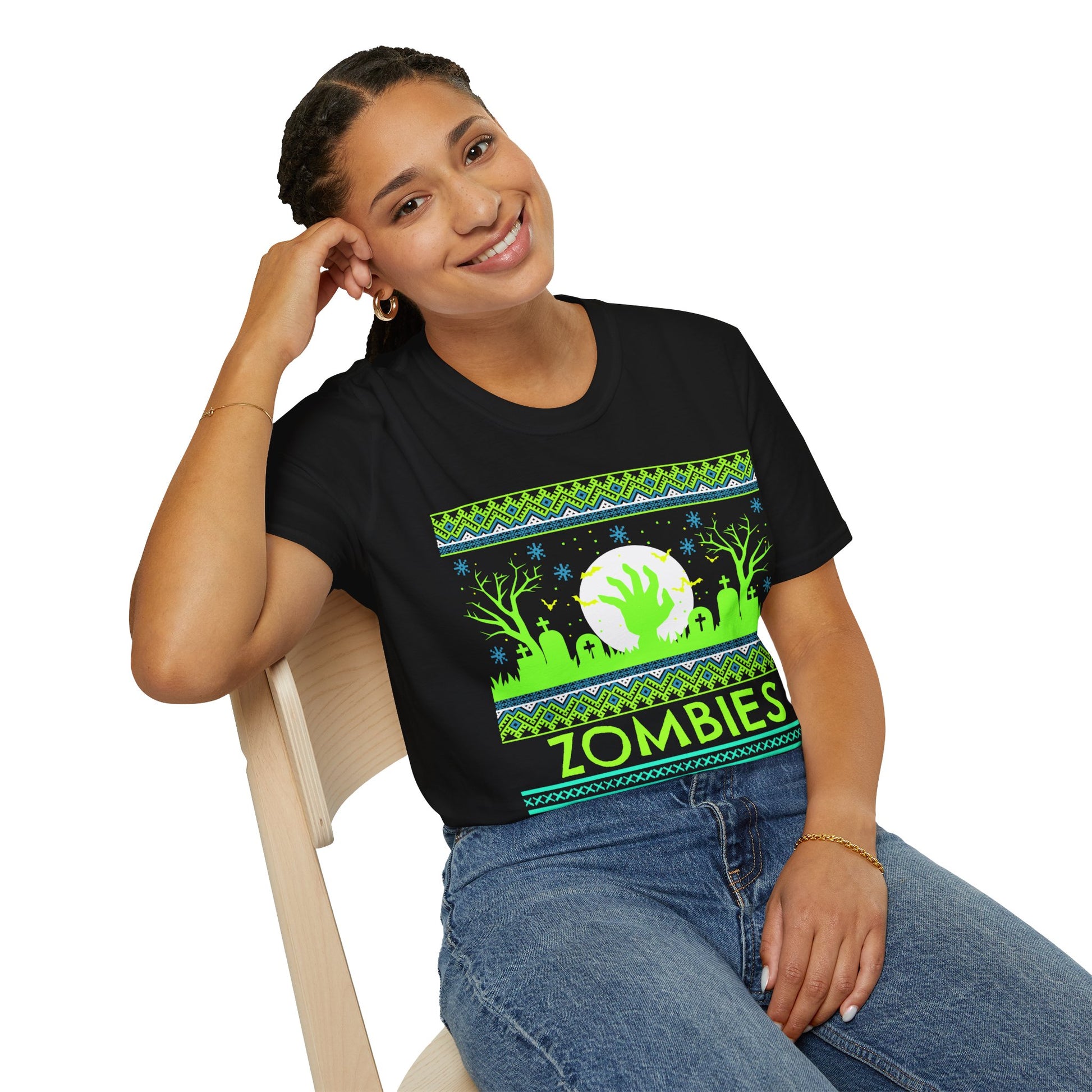 Person wearing a black t-shirt with a green and blue vibrant graphic design featuring a zombie theme and text 'Zombies Never Die' on a white background.