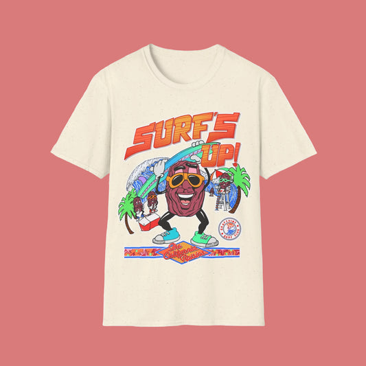 Beige t-shirt with a colourful graphic design featuring a Raisin character and 'Surf's Up!' text 