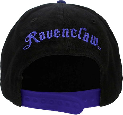 A black and blue unisex snapback cap with a Harry Potter Ravenclaw badge design on the front and Ravenclaw embroidered at the back