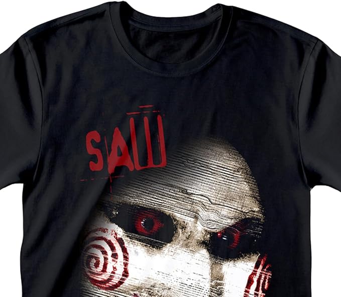 Black short sleeve T-shirt featuring a lose up eerie Saw horror movie face and I want to play a game Text,