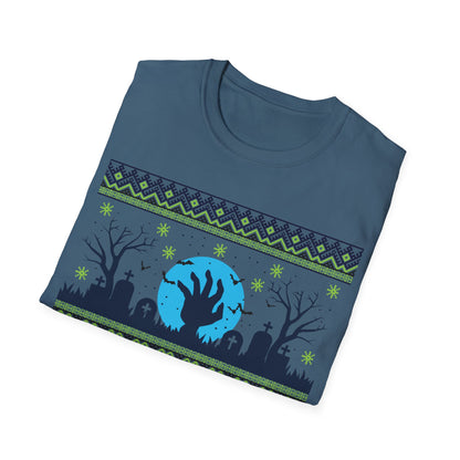 Folded blue t-shirt with a graphic design of a hand reaching out from a moonlit sky over a graveyard.