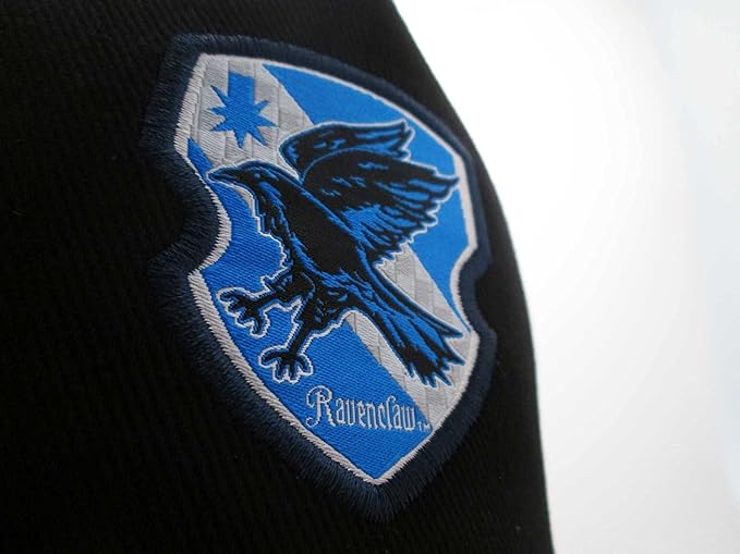 A black and blue unisex snapback cap with a Harry Potter Ravenclaw badge design on the front.