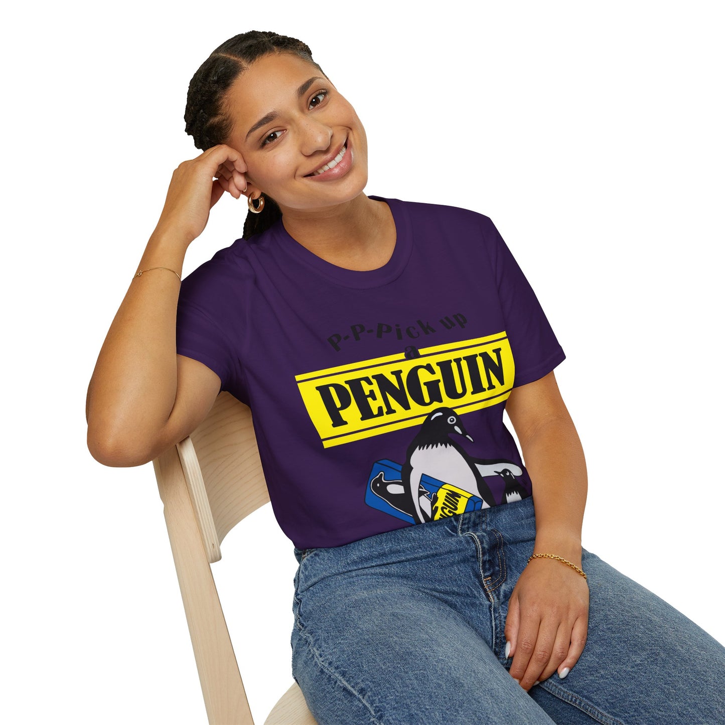 Person wearing a purple t-shirt with a penguin graphic and text P-P-Pick up a Penguin on a white background