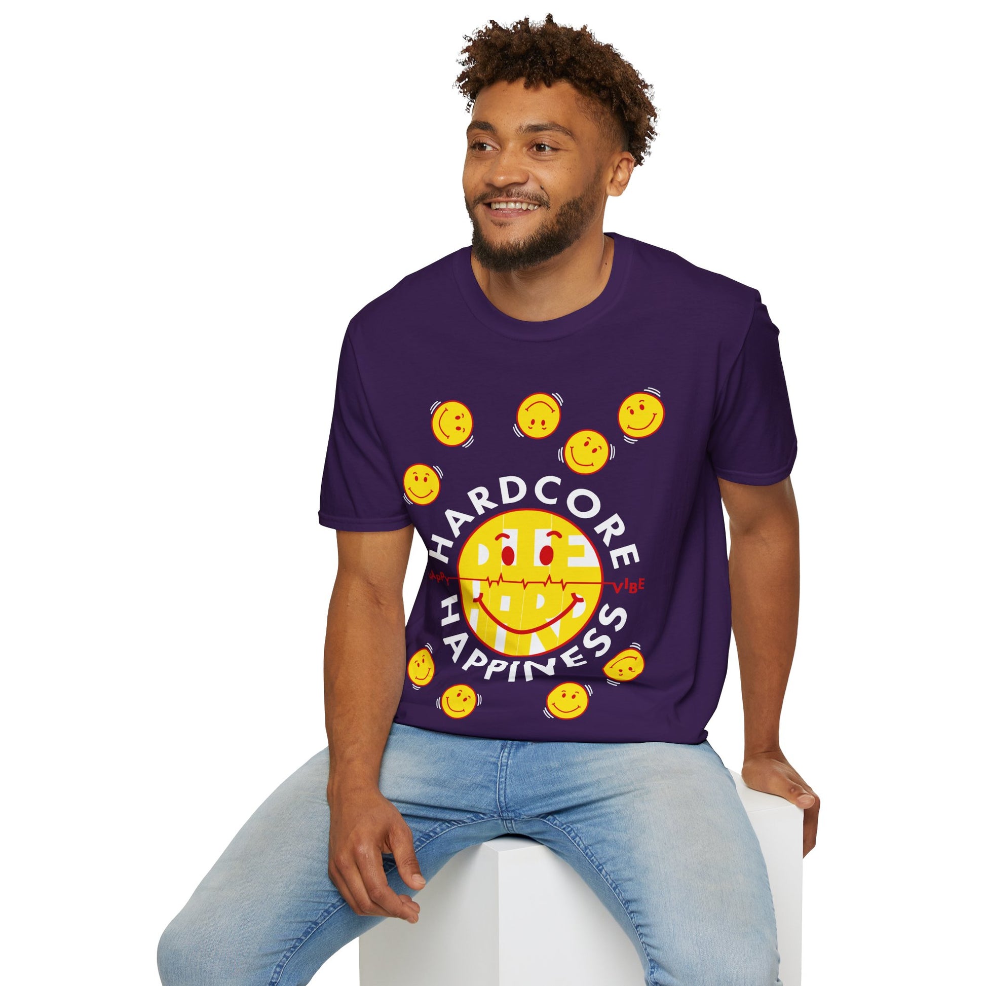 Man wearing a purple t-shirt with a smiley face graphic and Hardcore Happiness text on a white background