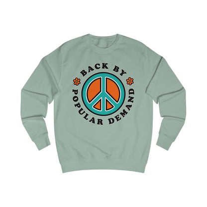 70s vibe light green sweatshirt with peace sign, flowers design and text Back By Popular Demand around 