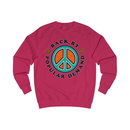 Pink sweatshirt with peace symbol and text on a white background