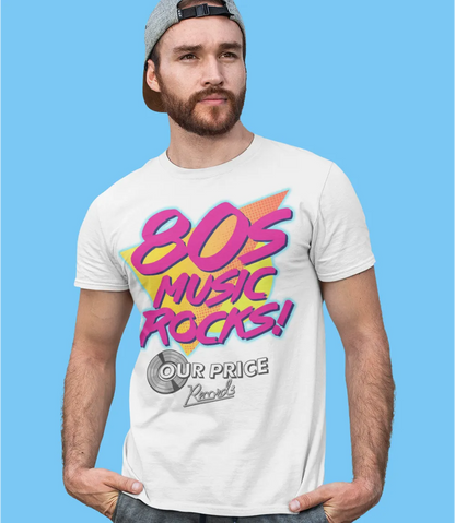 white men's unisex short sleeve t shirt laying against clear backdrop featuring 80s music rocks! large text in bright pink and our price records logo below in black and white, retro style colour background to text