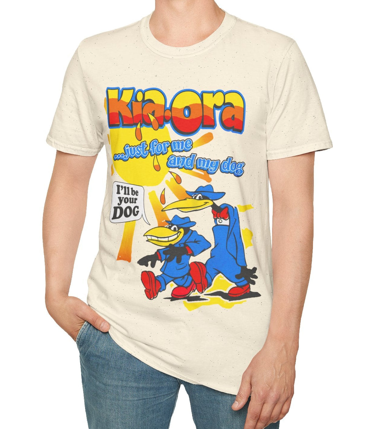 Person wearing a cream t-shirt with colourful graphic Kia-Ora design and text.