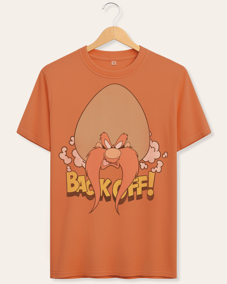 Official Looney Tunes Cinnamon t-shirt with Yosemite Sam cartoon character and 'Back Off!' text on a hanger against a cream background