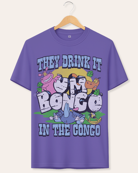 A purple short-sleeve graphic t-shirt hanging on a wooden hanger against a light beige background. The shirt features a colorful cartoon design of apes and a blue bird with the text 'THEY DRINK IT IN THE CONGO'.