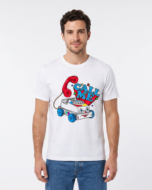 A man wearing a white crewneck t-shirt with a colorful retro graphic of a cartoon phone and toy car that reads 'CALL ME', paired with blue jeans, against a plain white studio background.