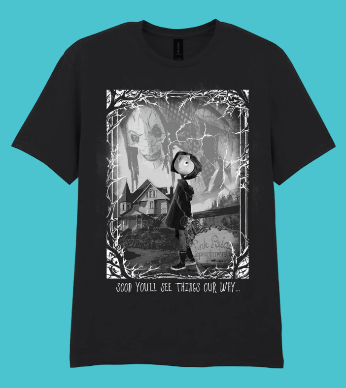 Official Coraline Black t-shirt with a mono horror scene graphic design with Coraline and text 'Soon you'll see things our way'