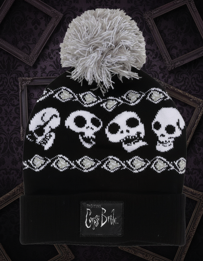 Black and white Corpse Bride beanie with skull pattern and pom-pom 