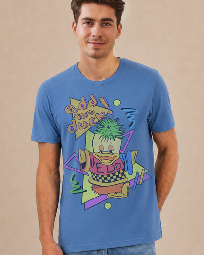 A man wearing a blue crewneck t-shirt with a colorful retro graphic of a duck character and the text 'Edd the Duck'.
