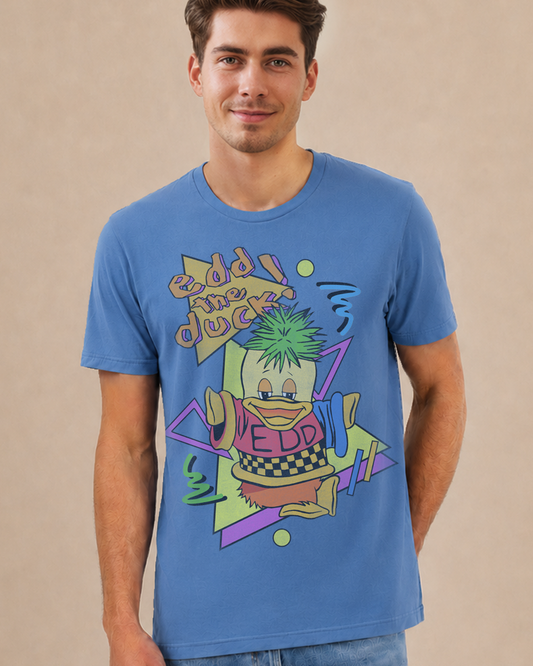 A man wearing a blue crewneck t-shirt with a colorful retro graphic of a duck character and the text 'Edd the Duck'.