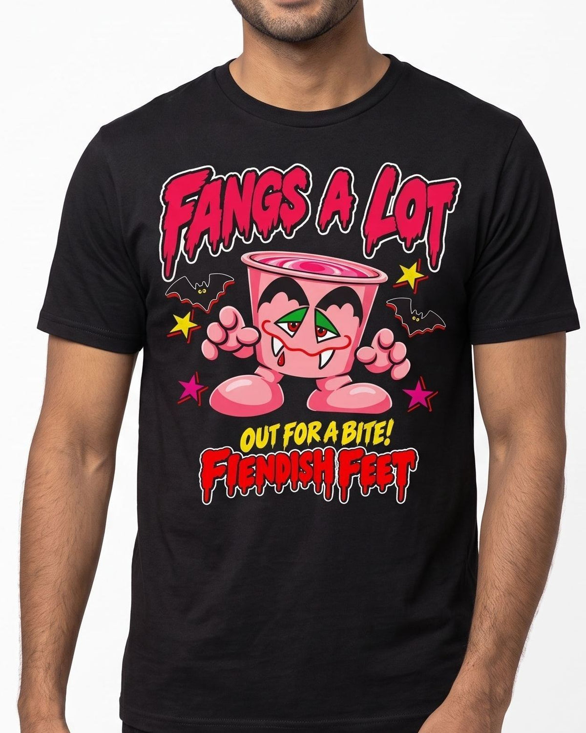 A man wearing a black short-sleeve graphic t-shirt with a cartoon character and the text 'Fangs a Lot Out for a Bite! Fiendish Feet' on the front, against a plain white background.