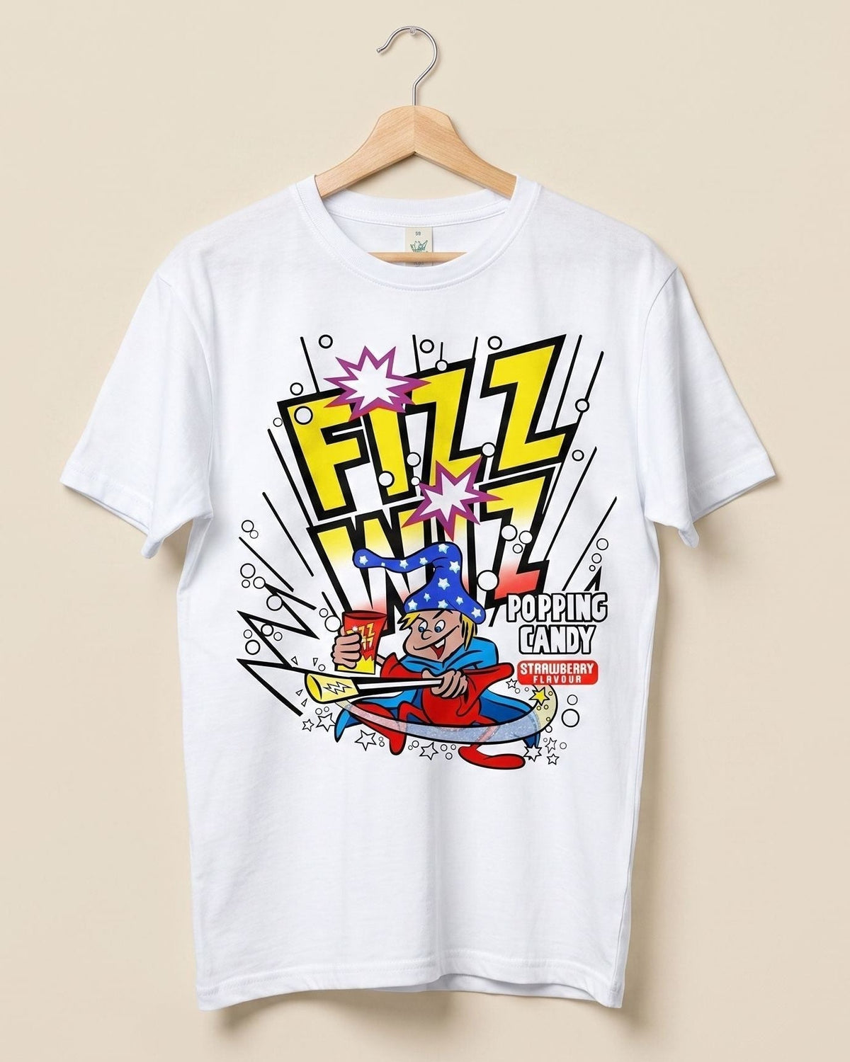 A white short-sleeve t-shirt hanging on a wooden hanger against a solid beige background. The shirt features a colorful comic-style wizard graphic on the front with the words 'FIZZ WIZ' in bold yellow letters,