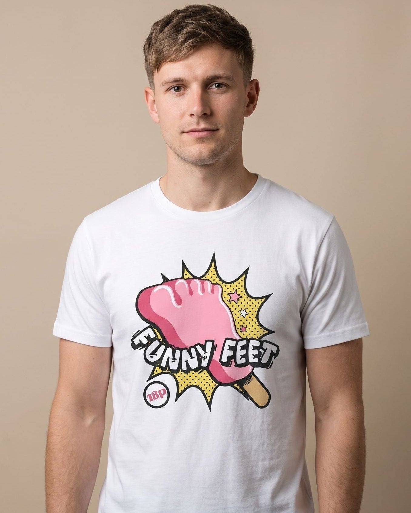 A man wearing a white crewneck t-shirt with a graphic print of a pink foot lolly in a yellow comic-style burst with the text 'FUNNY FEET'.