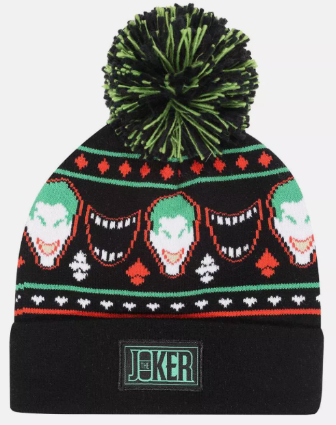 Knitted beanie with Joker design and pom-pom on a white background