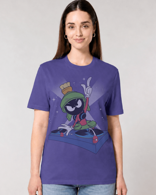 A woman modelling a crewneck t-shirt featuring a cartoon graphic of Marvin the Martian being a DJ and headphones, set against a plain light grey background.