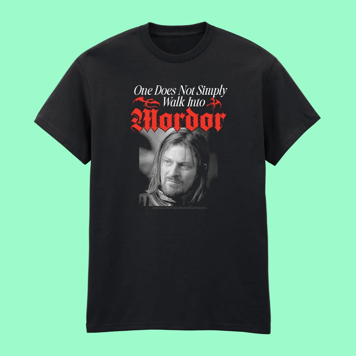 A black short-sleeve crewneck t-shirt featuring a graphic print of a man's face and the text 'One Does Not Simply Walk Into Mordor' in white and red lettering.