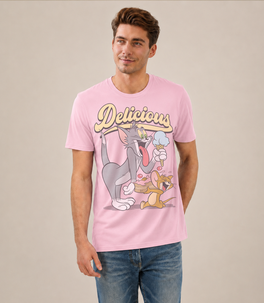 Man wearing an Official Tom and Jerry Pink t-shirt with cartoon Tom eating ice cream and Jerry eating cake and 'Delicious' text above 