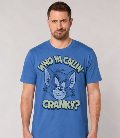 Man wearing an Official Tom and Jerry Blue t-shirt with cartoon Tom character and Who Ya Callin' Cranky? text 