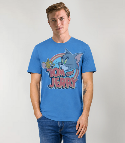 Man wearing a blue classic 'Tom and Jerry' logo t-shirt against a plain background